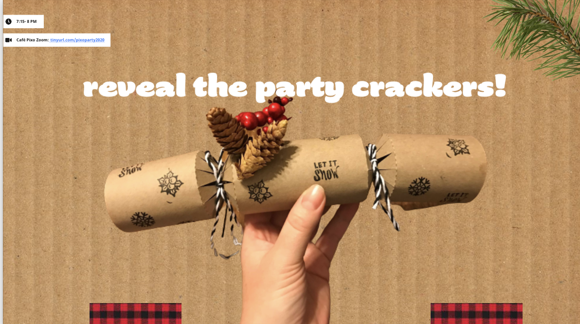 A hand holding up a paper party cracker decorated with pinecones and berries.