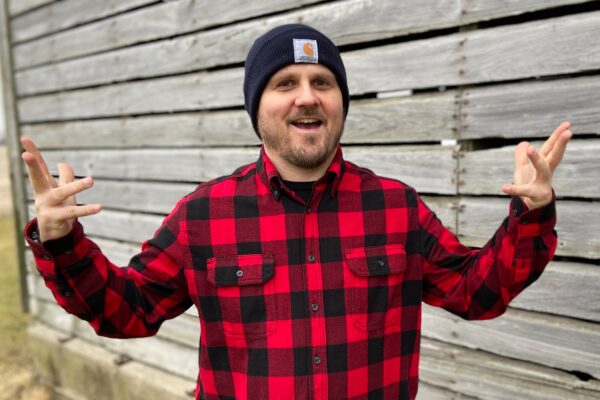 Engineer Jason Rambeck, wearing flannel, looking very much like the chicken farmer he is.