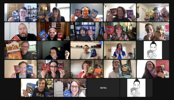A Zoom grid of staff members in a meeting holding up Dorito bags