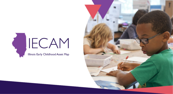 Children in a classroom with the IECAM logo