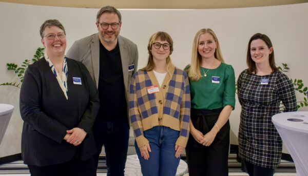 Part of the Pixo team shown standing in a line facing the camera: Melinda, Jason, Isabel, Jackie, and Leah