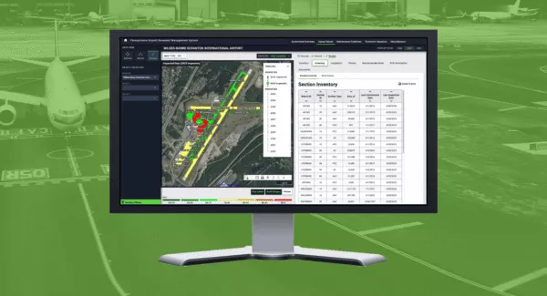 A desktop monitor displays a screenshot of the web application, over a faded green background photo of an airplane on a runway.
