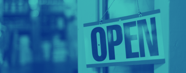 a teal and navy tinted photo of an open door with a hanging 